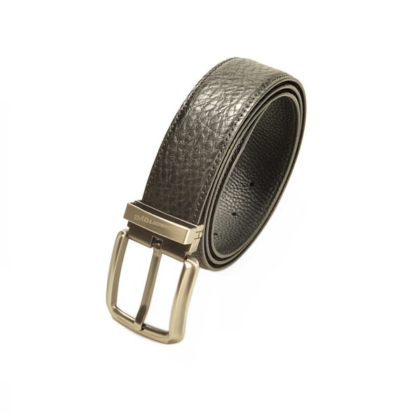 Close-up of a stylish black pin buckle belt with embossed floral patterns and a serrated design for easy adjustments.